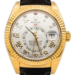 Montre ROLEX "Sky - Dweller" en or jaune, argent, cuir et saphir - Castafiore