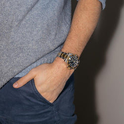 Montre ROLEX "Submariner Date" en or jaune, saphir et acier - Castafiore