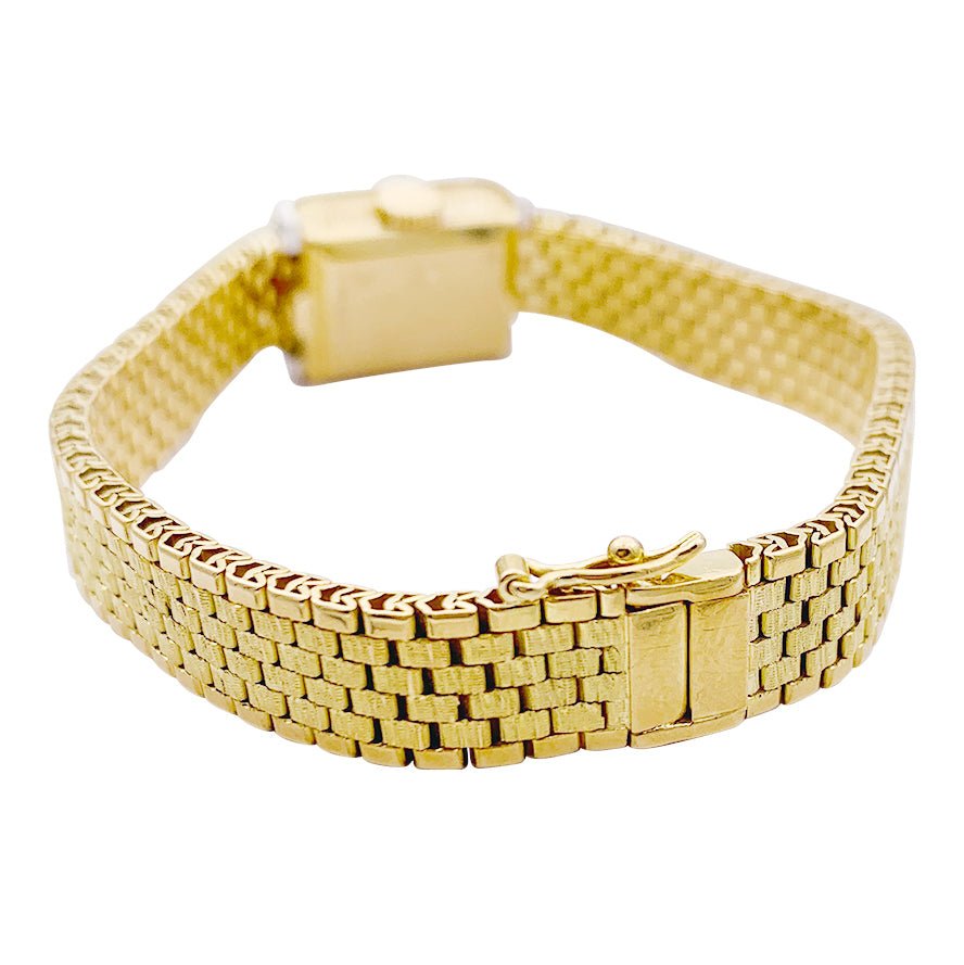 Montre vintage André Col, or jaune, platine, diamants. - Castafiore