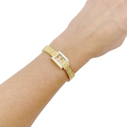 Montre vintage André Col, or jaune, platine, diamants. - Castafiore