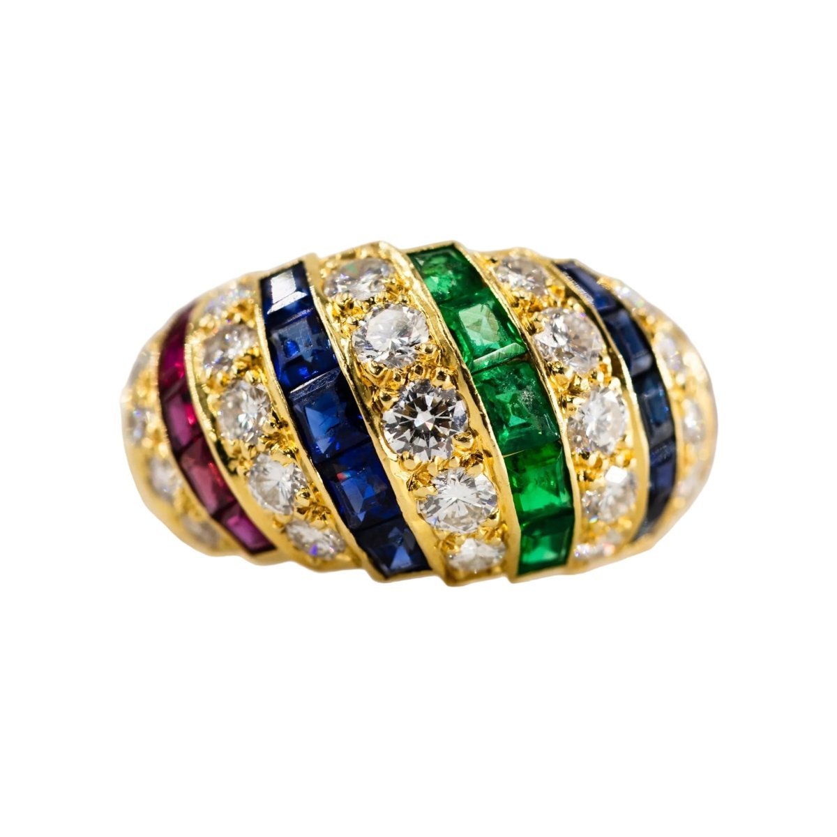Parure CARTIER en or jaune, saphirs, émeraudes, rubis et diamants - Castafiore