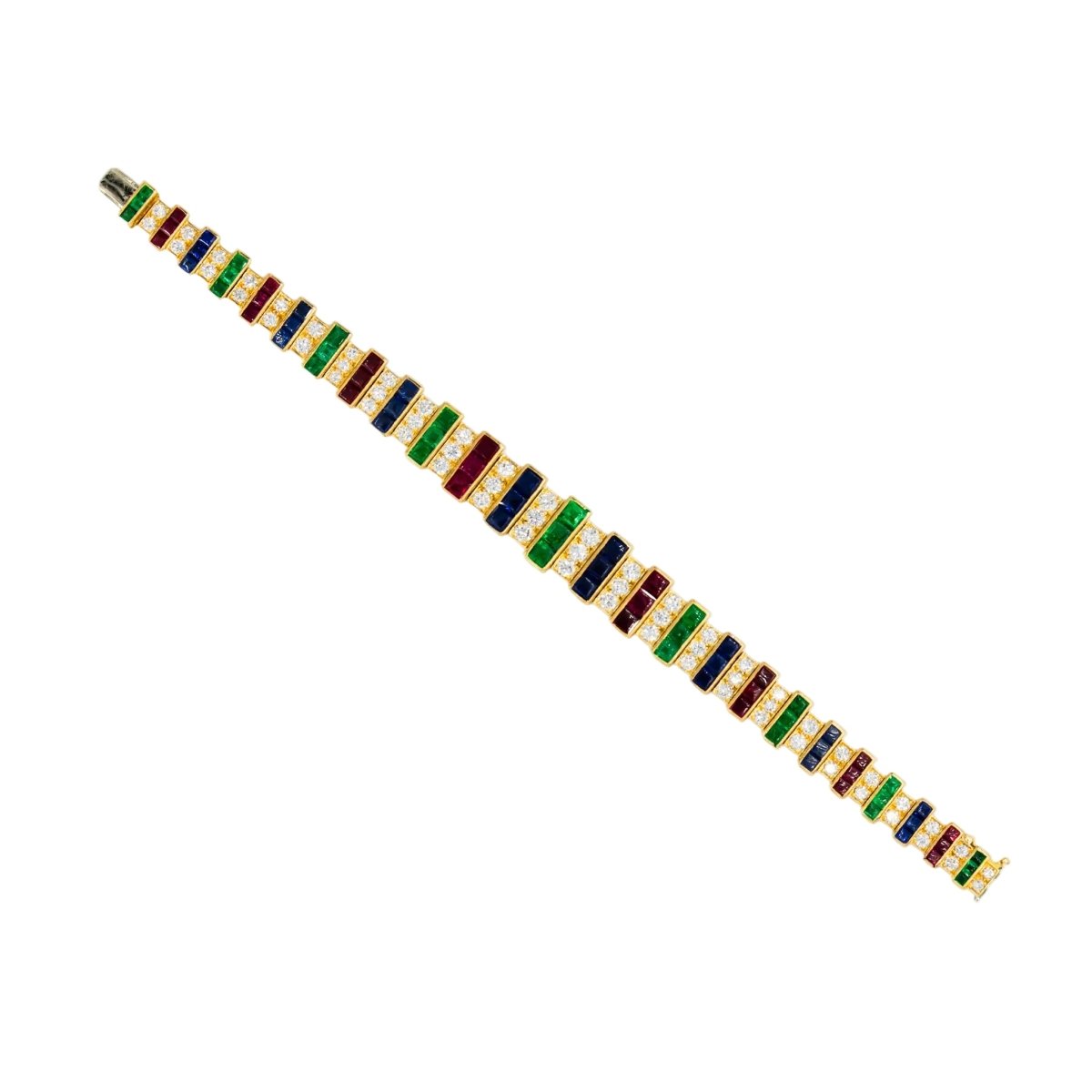 Parure CARTIER en or jaune, saphirs, émeraudes, rubis et diamants - Castafiore