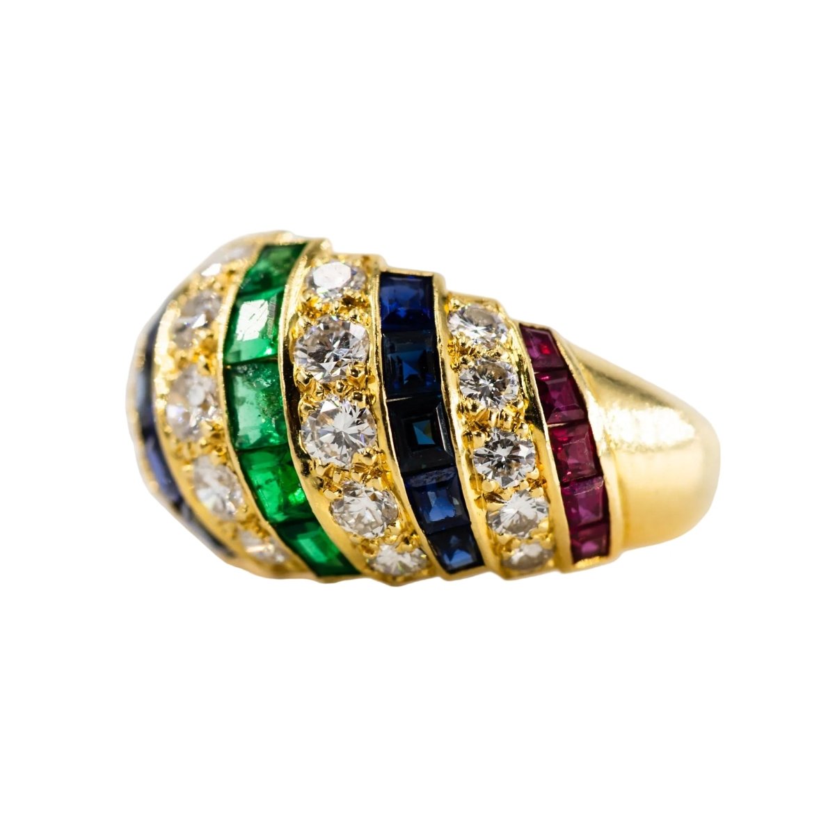 Parure CARTIER en or jaune, saphirs, émeraudes, rubis et diamants - Castafiore