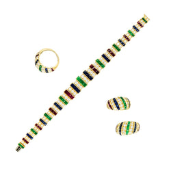 Parure CARTIER en or jaune, saphirs, émeraudes, rubis et diamants - Castafiore