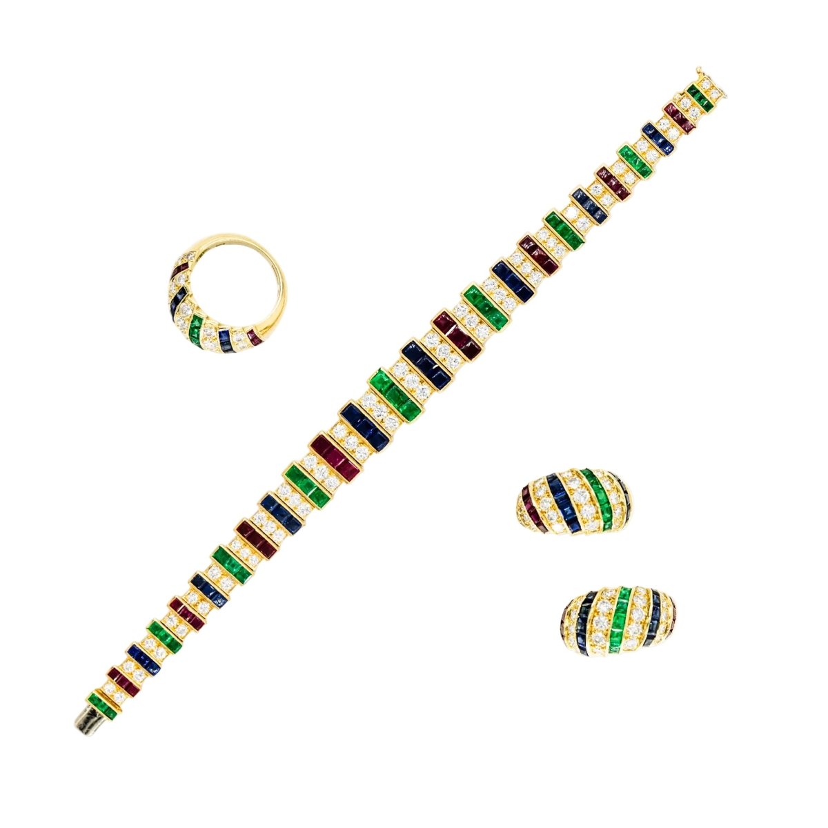 Parure CARTIER en or jaune, saphirs, émeraudes, rubis et diamants - Castafiore