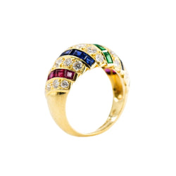 Parure CARTIER en or jaune, saphirs, émeraudes, rubis et diamants - Castafiore