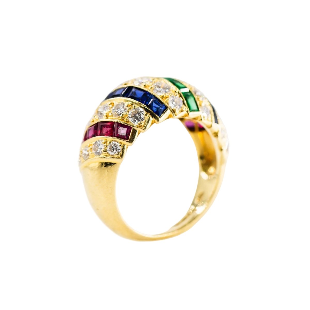 Parure CARTIER en or jaune, saphirs, émeraudes, rubis et diamants - Castafiore