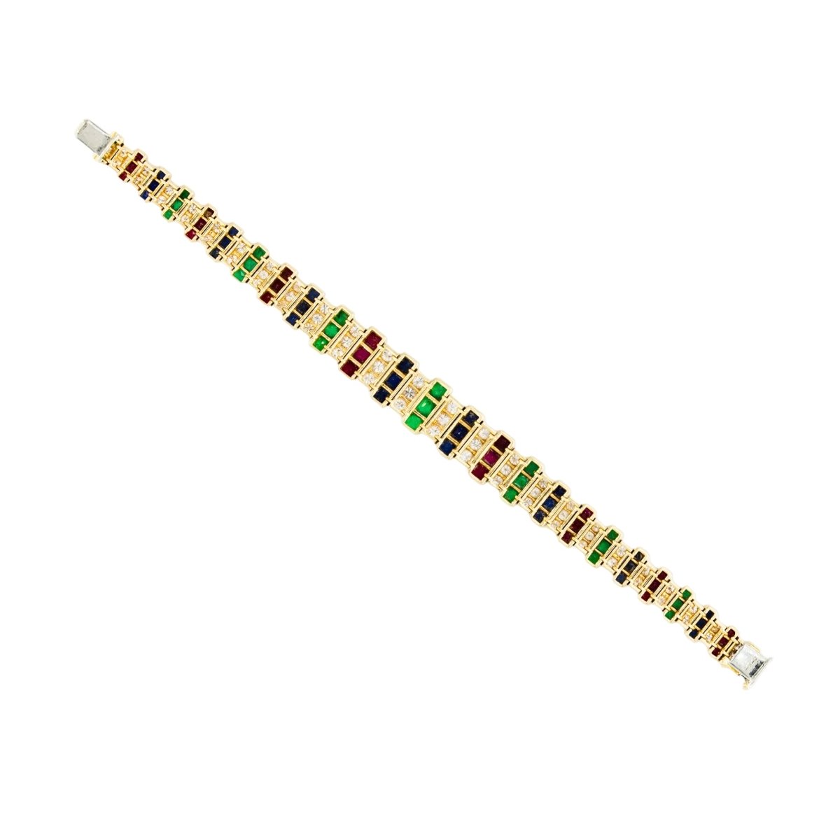 Parure CARTIER en or jaune, saphirs, émeraudes, rubis et diamants - Castafiore
