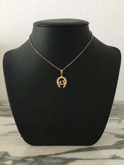 Pendentif en or jaune 18K en forme de fer à cheval