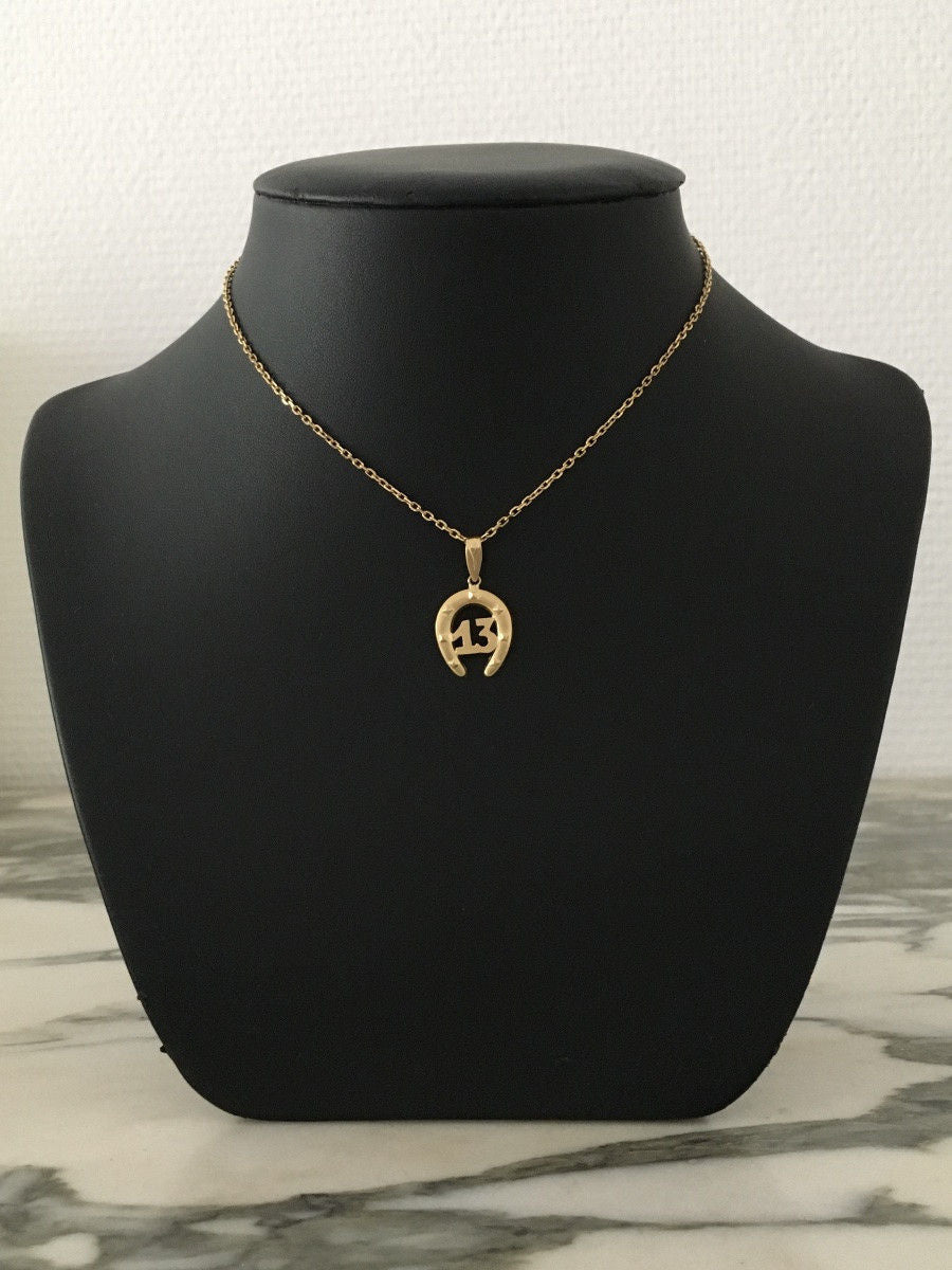 Pendentif en or jaune 18K en forme de fer à cheval