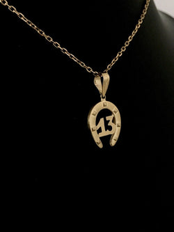 Pendentif en or jaune 18K en forme de fer à cheval