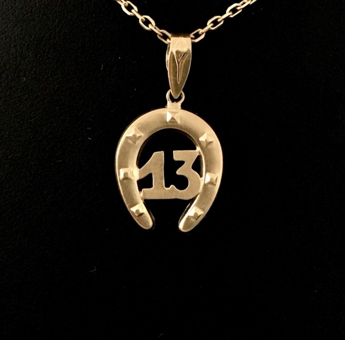 Pendentif en or jaune 18K en forme de fer à cheval