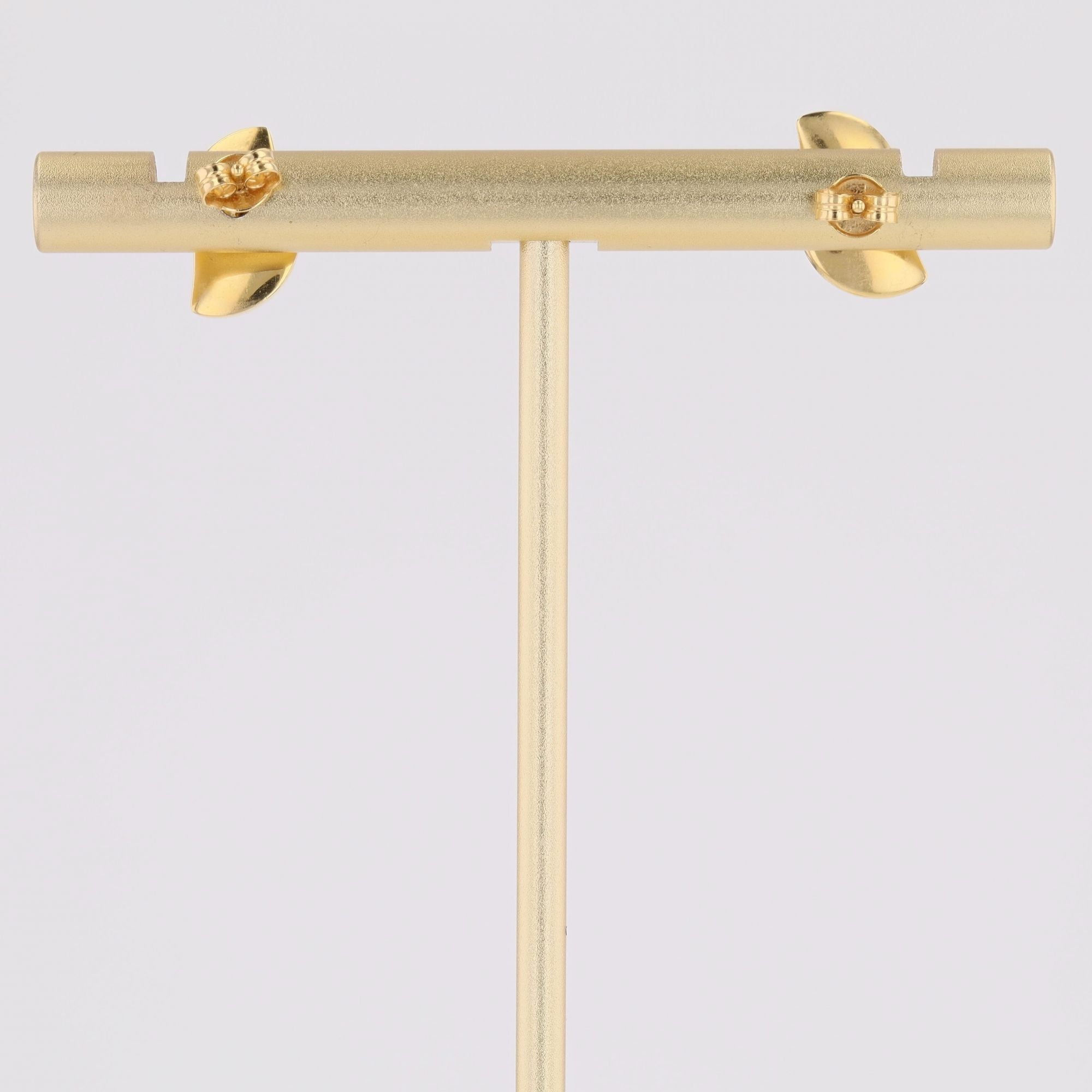 Puces d'oreilles or jaune virgule bombée