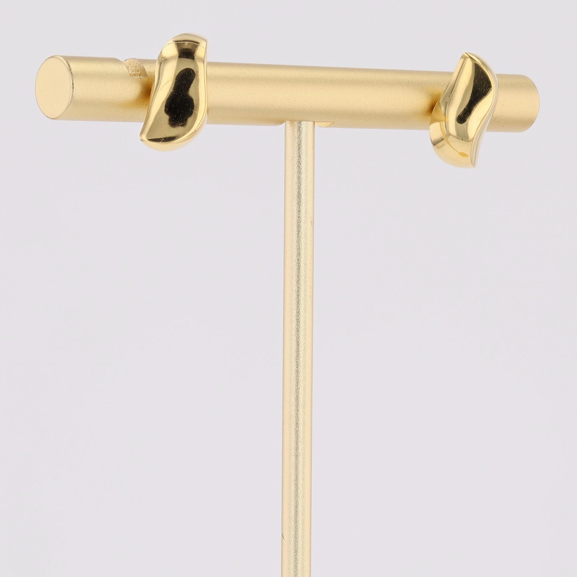 Puces d'oreilles or jaune virgule bombée