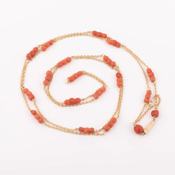 Sautoir en or jaune et boules de corail facettés - Castafiore