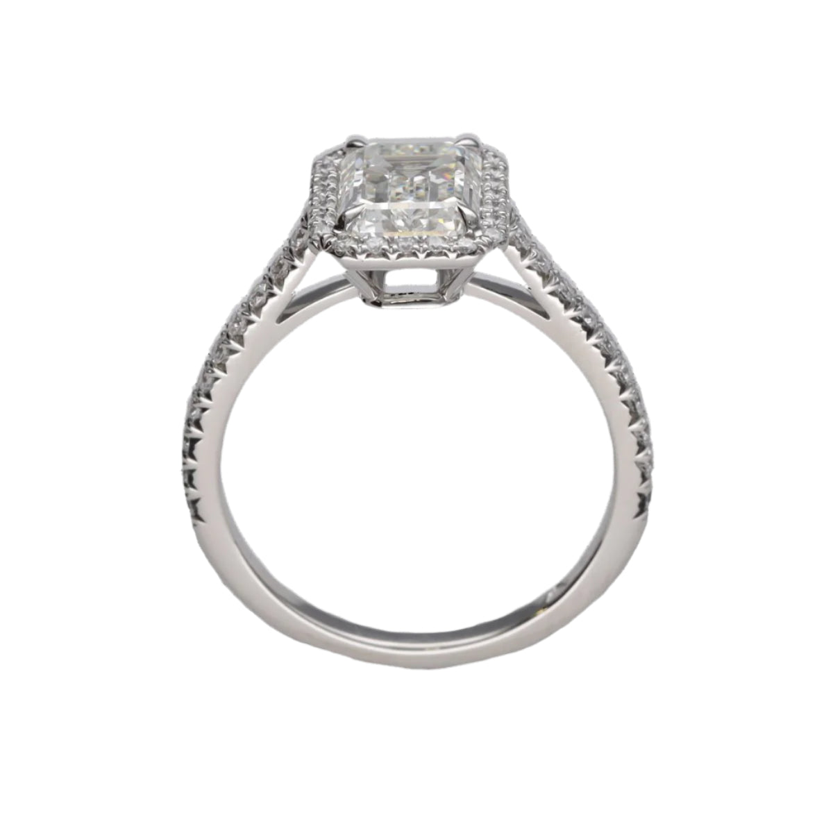Solitaire Tiffany & Co "Soleste Halo" en platine avec un diamant taille émeraude de 1,59 Cts (H - VVS1). Taille 50. - Castafiore