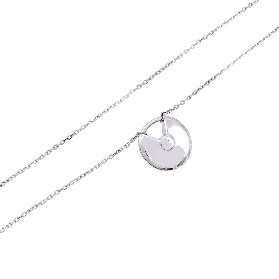 Collier Cartier, "Amulette", or blanc, diamants.