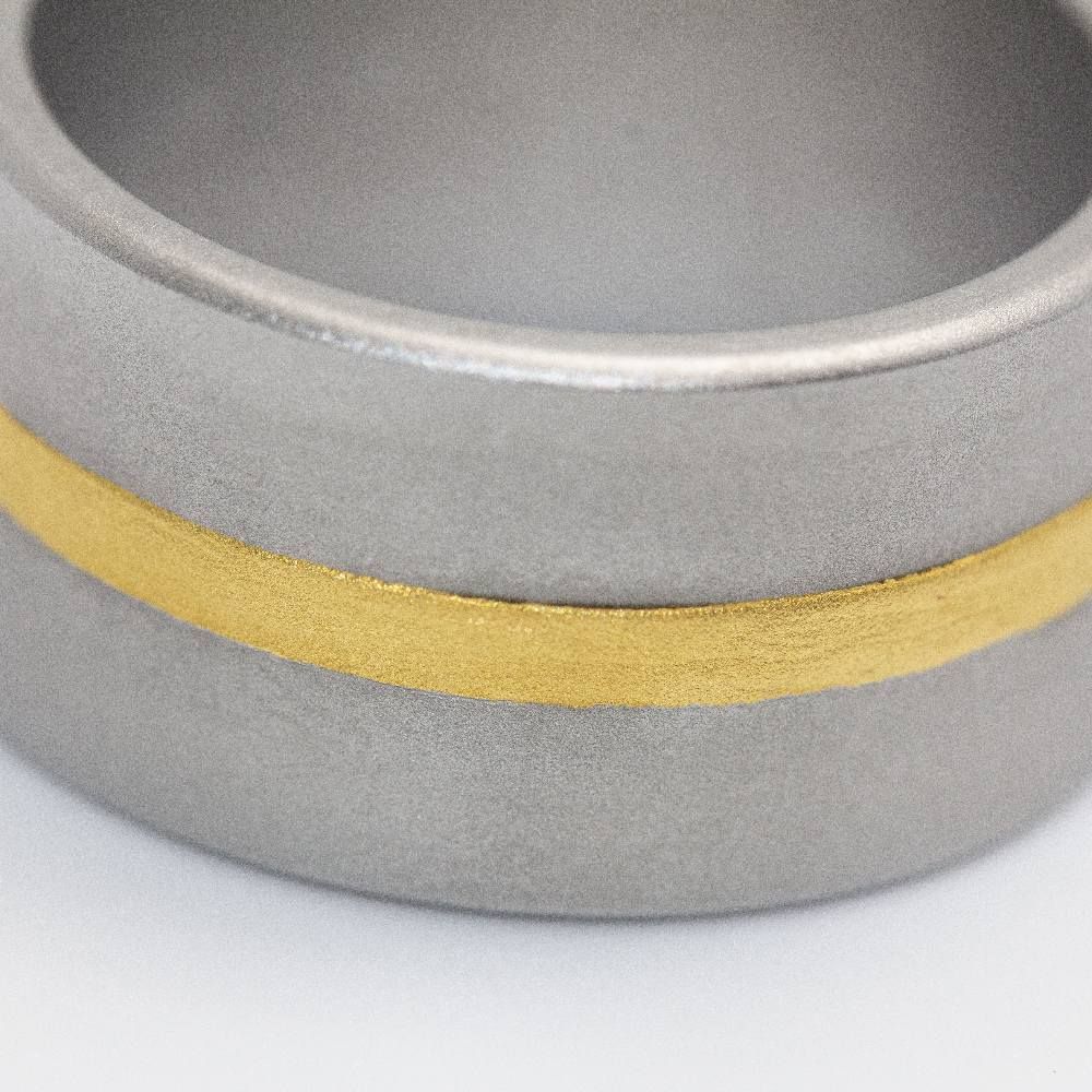 Bague Bandeau NIESSING en or jaune et acier - Castafiore