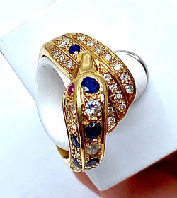 Bague dauphin en or jaune 18 carats ,saphirs ,diamants et rubis - Castafiore