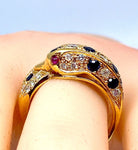 Bague dauphin en or jaune 18 carats ,saphirs ,diamants et rubis - Castafiore