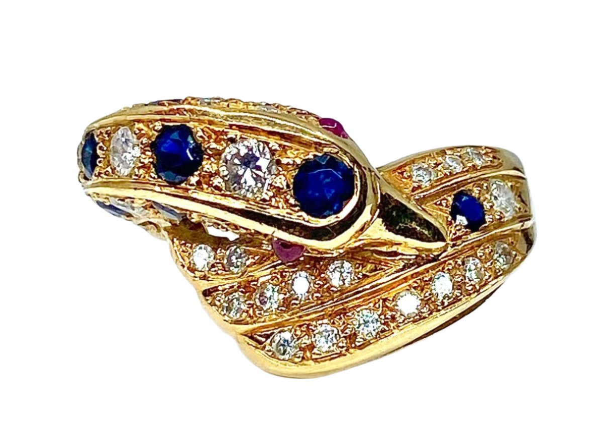 Bague dauphin en or jaune 18 carats ,saphirs ,diamants et rubis - Castafiore