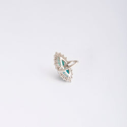 Bague en or gris, ornée de deux cabochons turquoises et diamants - Castafiore