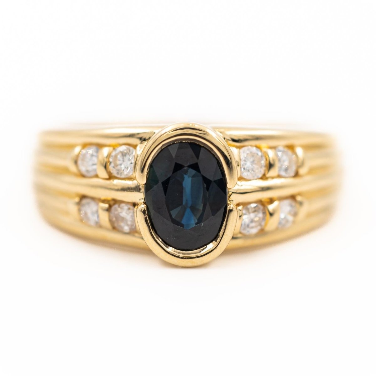 Bague en or jaune, diamants et saphir - Castafiore