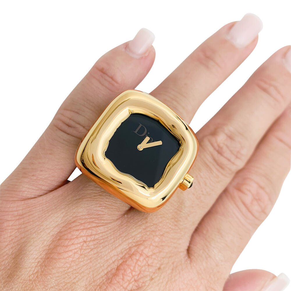 Bague montre Dior, modèle "Nougat", en or jaune et onyx - Castafiore