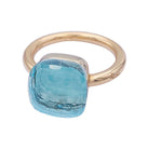 Bague Pomellato, "Nudo Maxi", deux ors et topaze bleue. - Castafiore