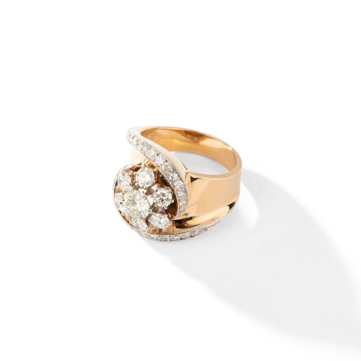 Swirl ring in yellow gold platinum and diamonds