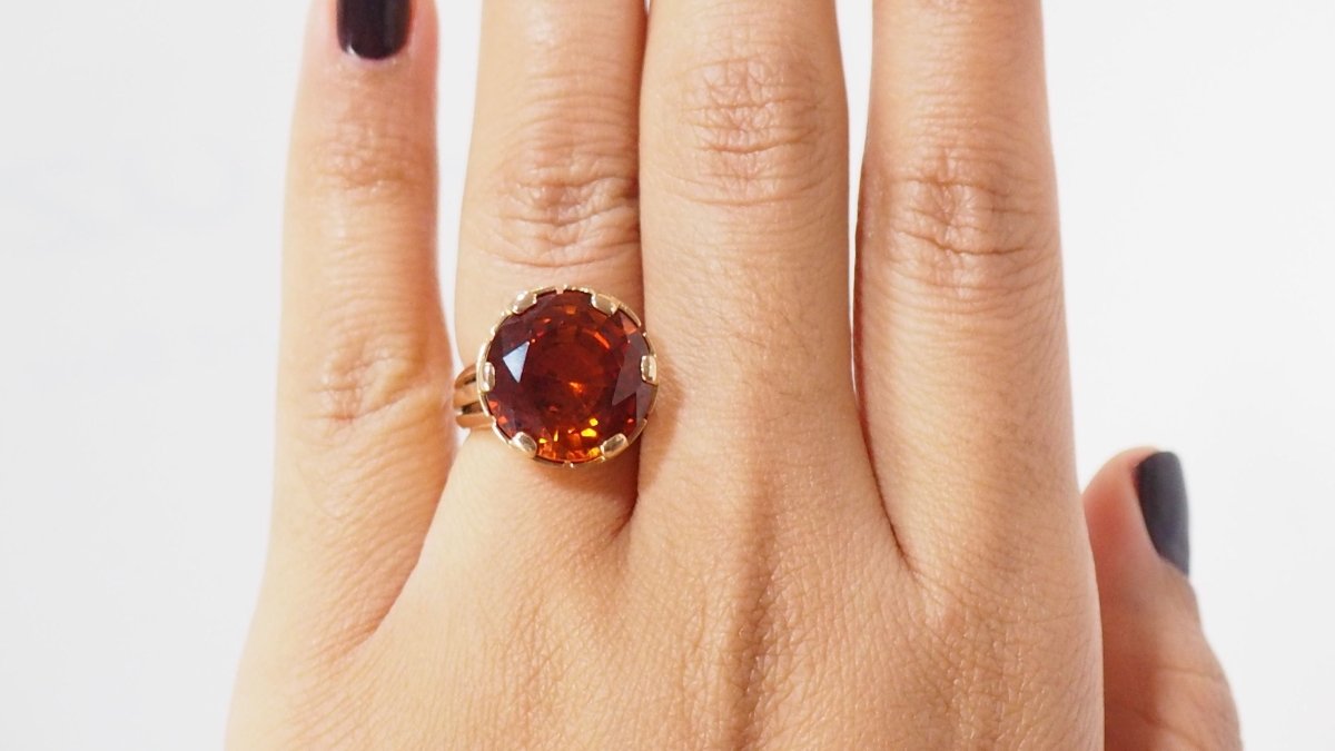 Bague vintage en or rose et saphir orange - Castafiore
