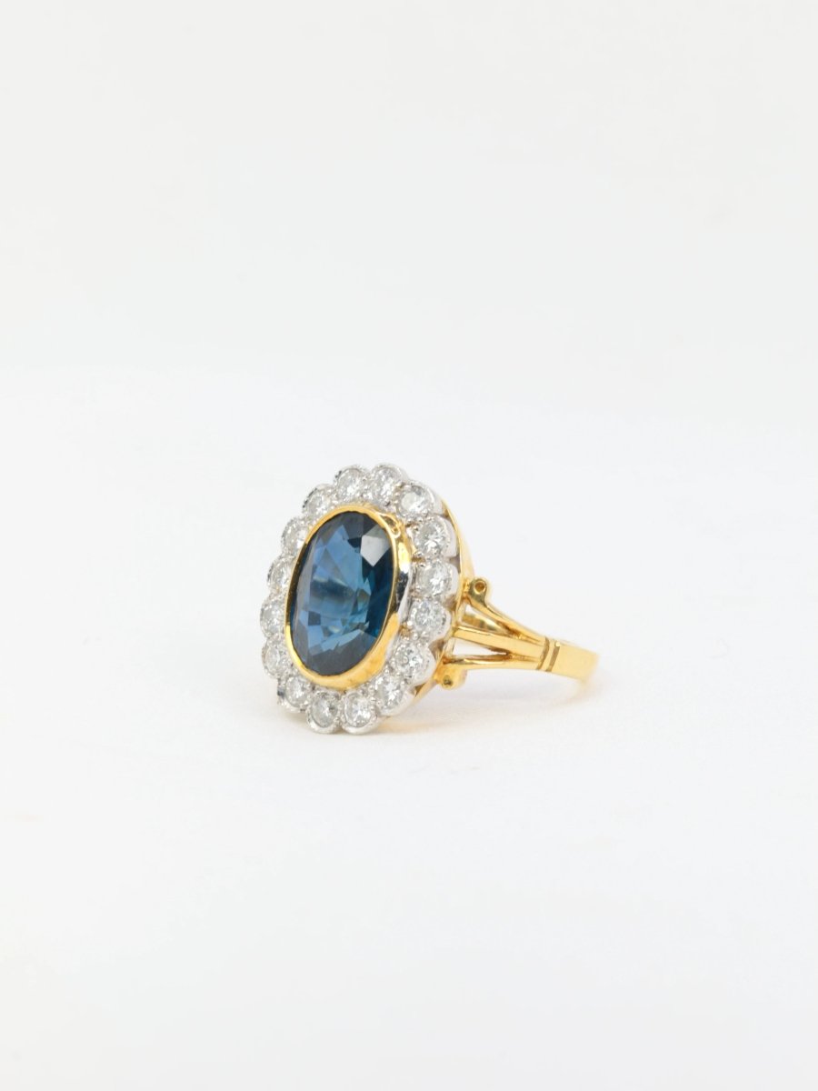 Bague vintage marguerite en or, saphir et diamants - Castafiore