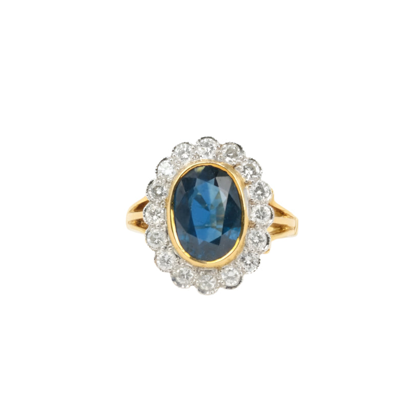 Bague vintage marguerite en or, saphir et diamants - Castafiore