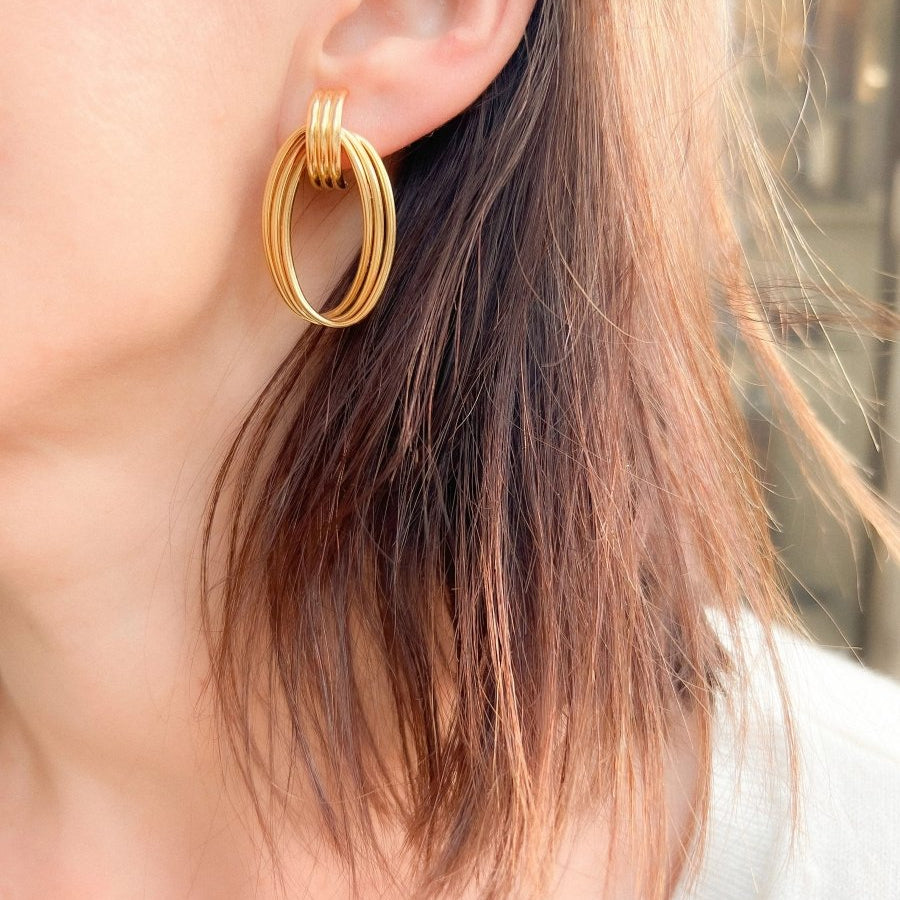 Boucles d'oreilles or jaune anneaux entrelacés - Castafiore