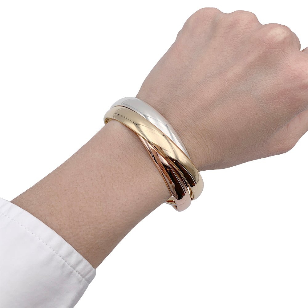Bracelet Cartier, "Trinity", 3 tons d'or - Castafiore