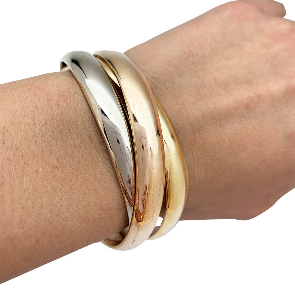 Bracelet Cartier, "Trinity", 3 tons d'or - Castafiore
