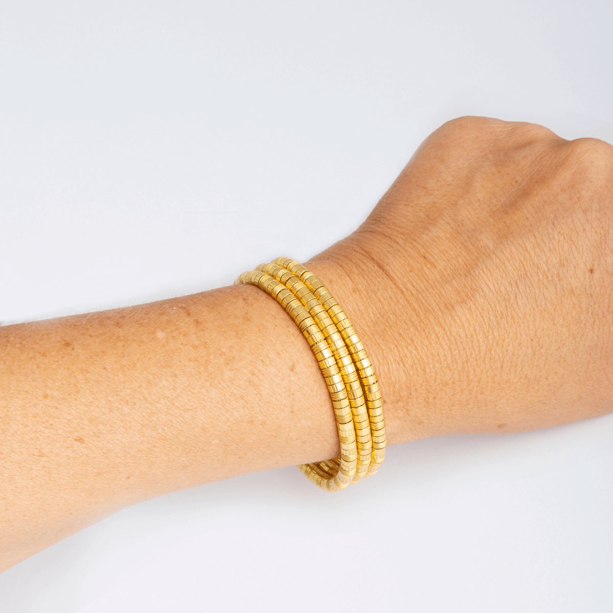 Bracelet en or jaune 18 carats composé de trois rangs, signé LALAOUNIS - Castafiore