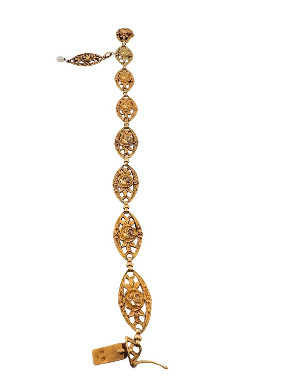 Bracelet en or jaune avec maillons à décor floral - Castafiore