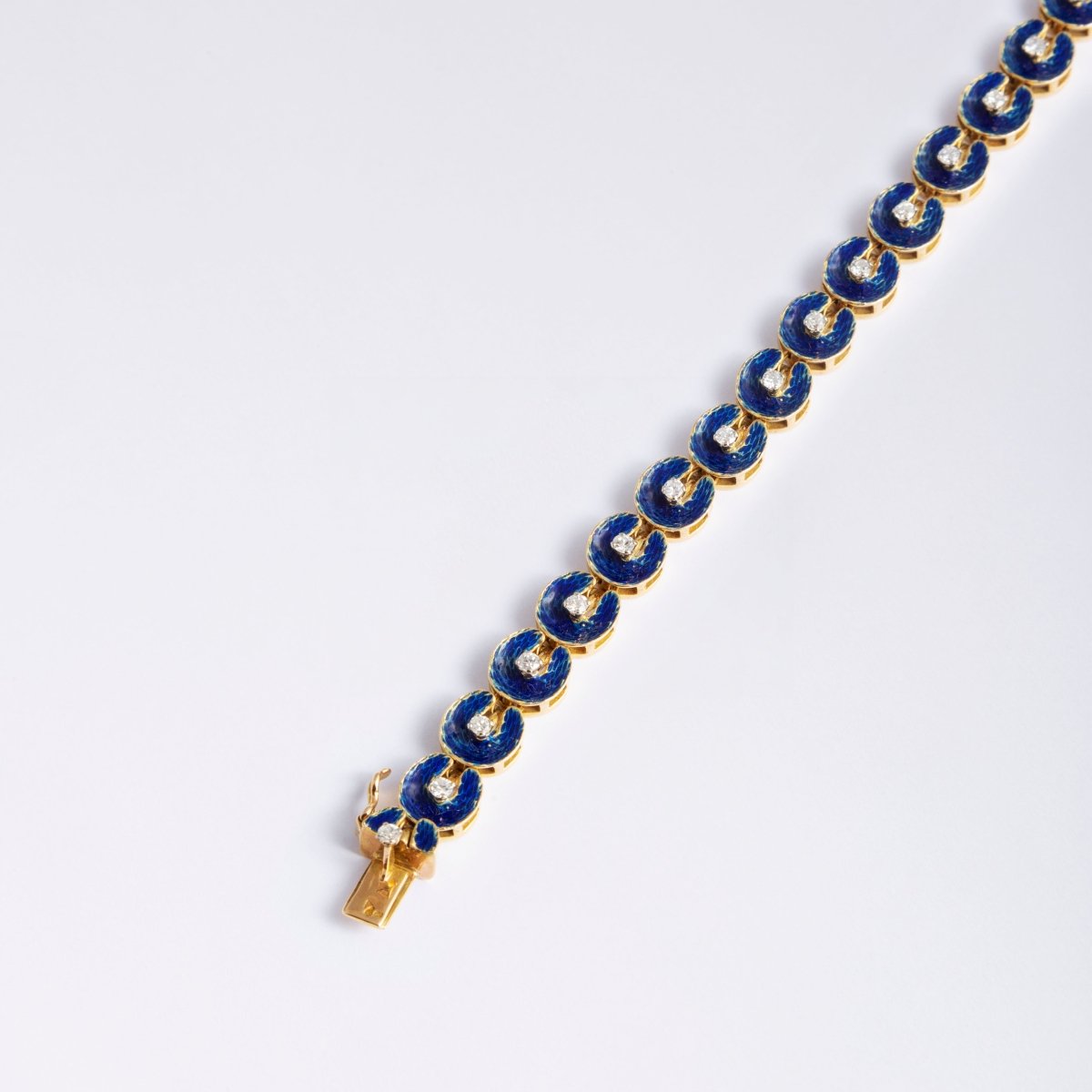 Bracelet en or jaune, émail bleu, sertie d'un diamant - Castafiore