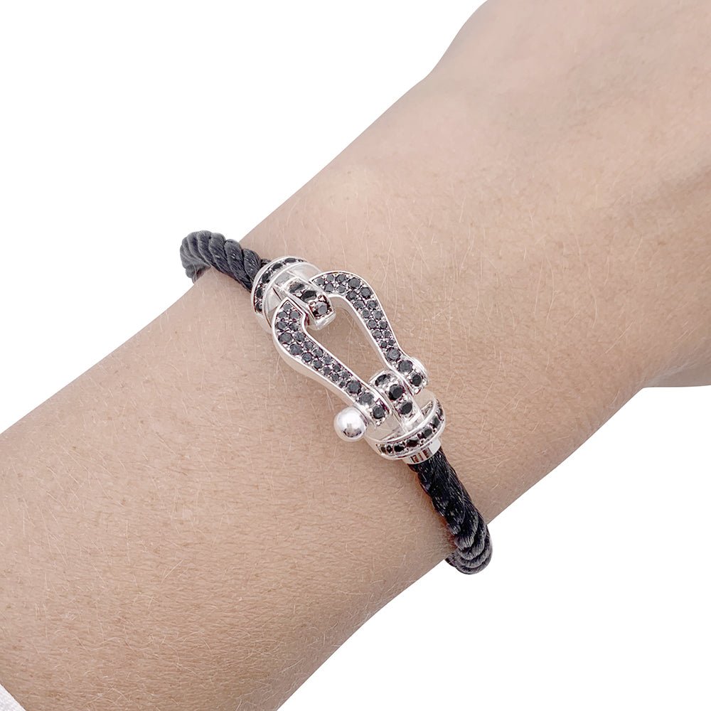 Bracelet FRED "Force 10" en or blanc, acier et diamants noirs - Castafiore