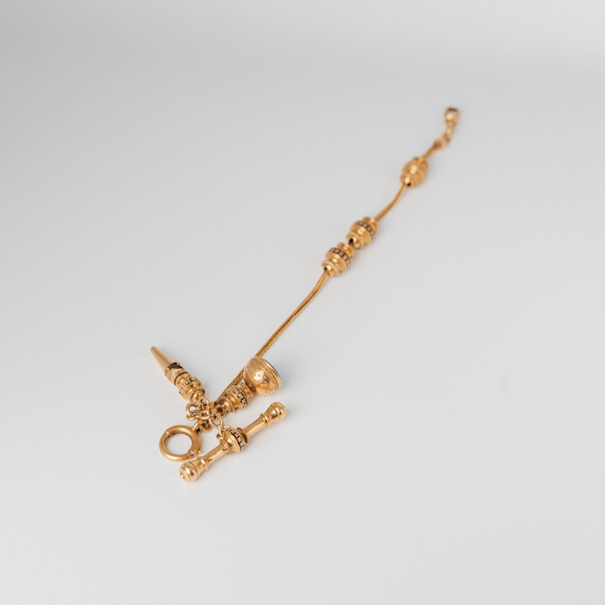 Bracelet giletière en or jaune et rose avec sa clef et son crochet - Castafiore