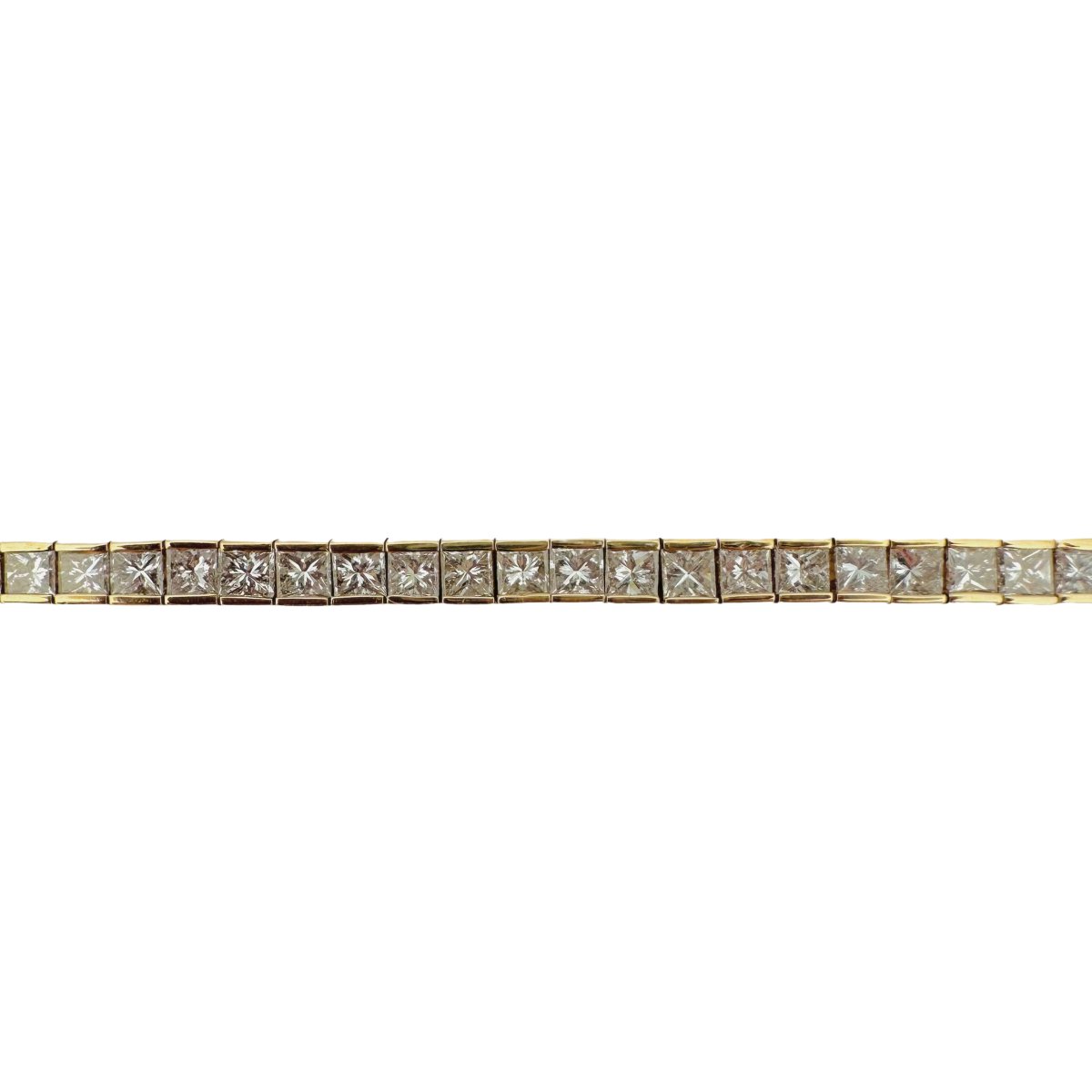 Bracelet Ligne tennis en or jaune serti de diamants taille princesse. - Castafiore