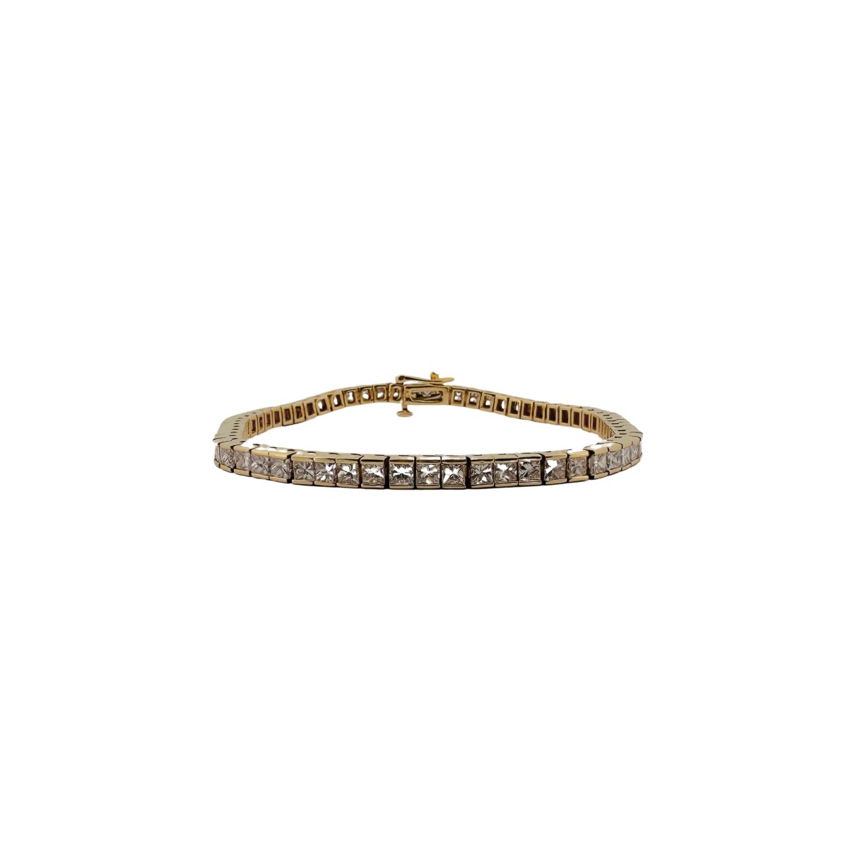 Bracelet Ligne tennis en or jaune serti de diamants taille princesse. - Castafiore