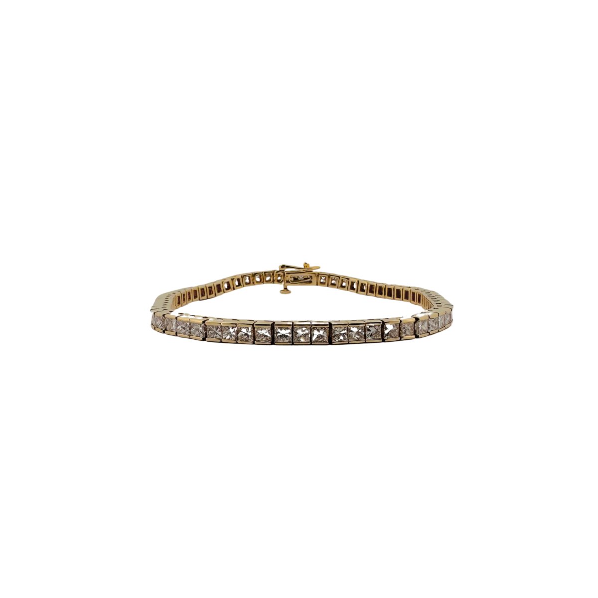 Bracelet Ligne tennis en or jaune serti de diamants taille princesse. - Castafiore