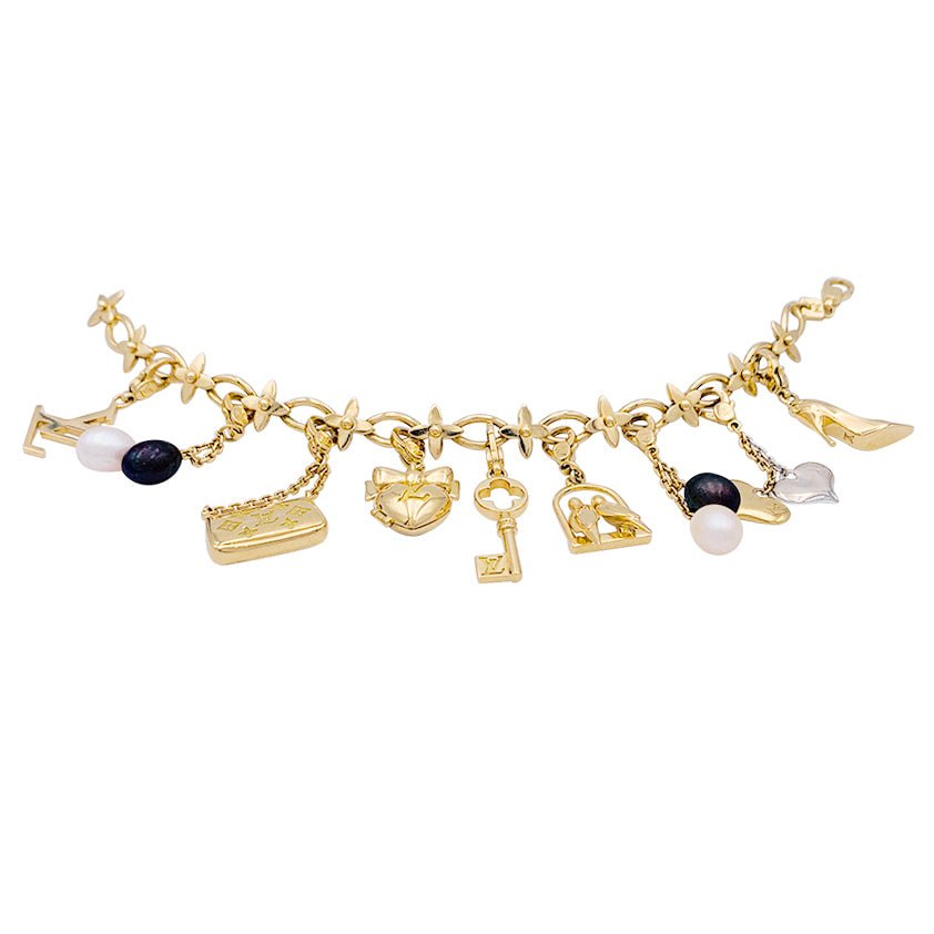 Bracelet Louis Vuitton, "Idylle", breloques, or jaune, or blanc, perles. - Castafiore