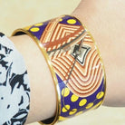 Bracelet Manchette HERMÈS en métal doré émaillé - Castafiore