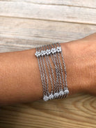 Bracelet or gris et diamant sur chaine força limée alternée de 4 motifs avec des fleurs - Castafiore