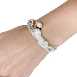 CARTIER “Panthère” bracelet in white gold, diamonds, emerald and