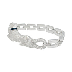 Bracelet "Panthère " CARTIER en or blanc, diamants, émeraude et onyx - Castafiore