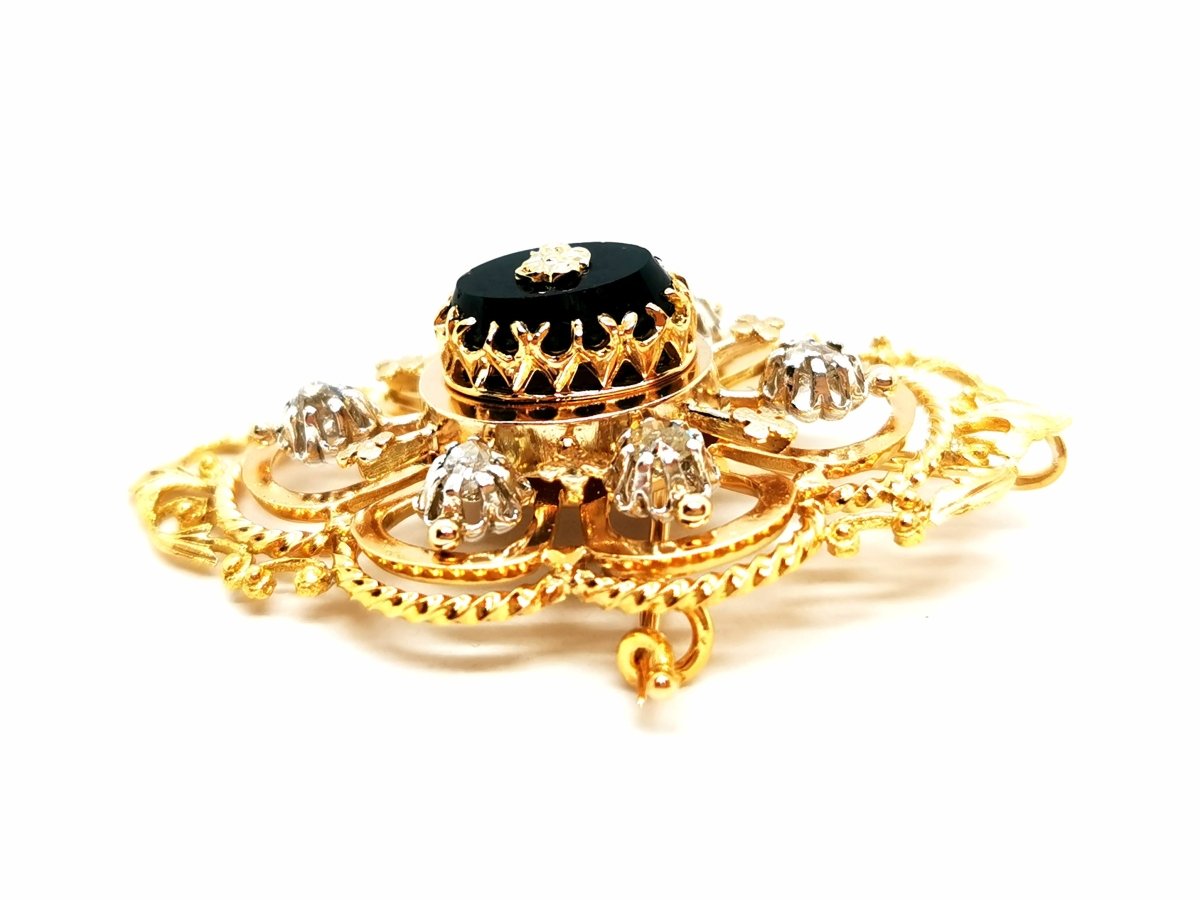 Broche Art déco en or jaune, platine, diamants et onyx - Castafiore